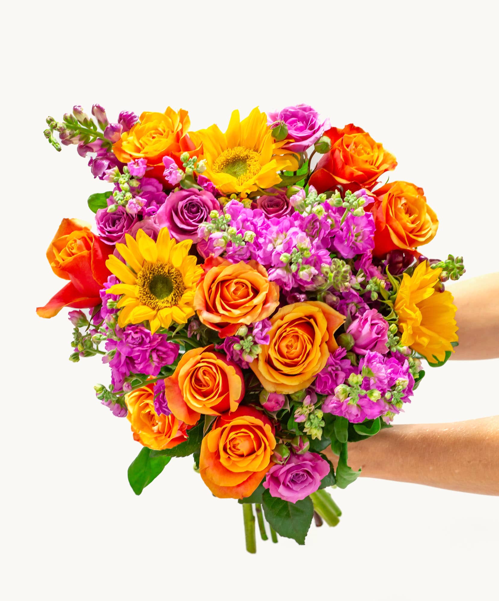 Vibrant mixed floral bouquet featuring sunflowers, roses, and colorful blossoms.