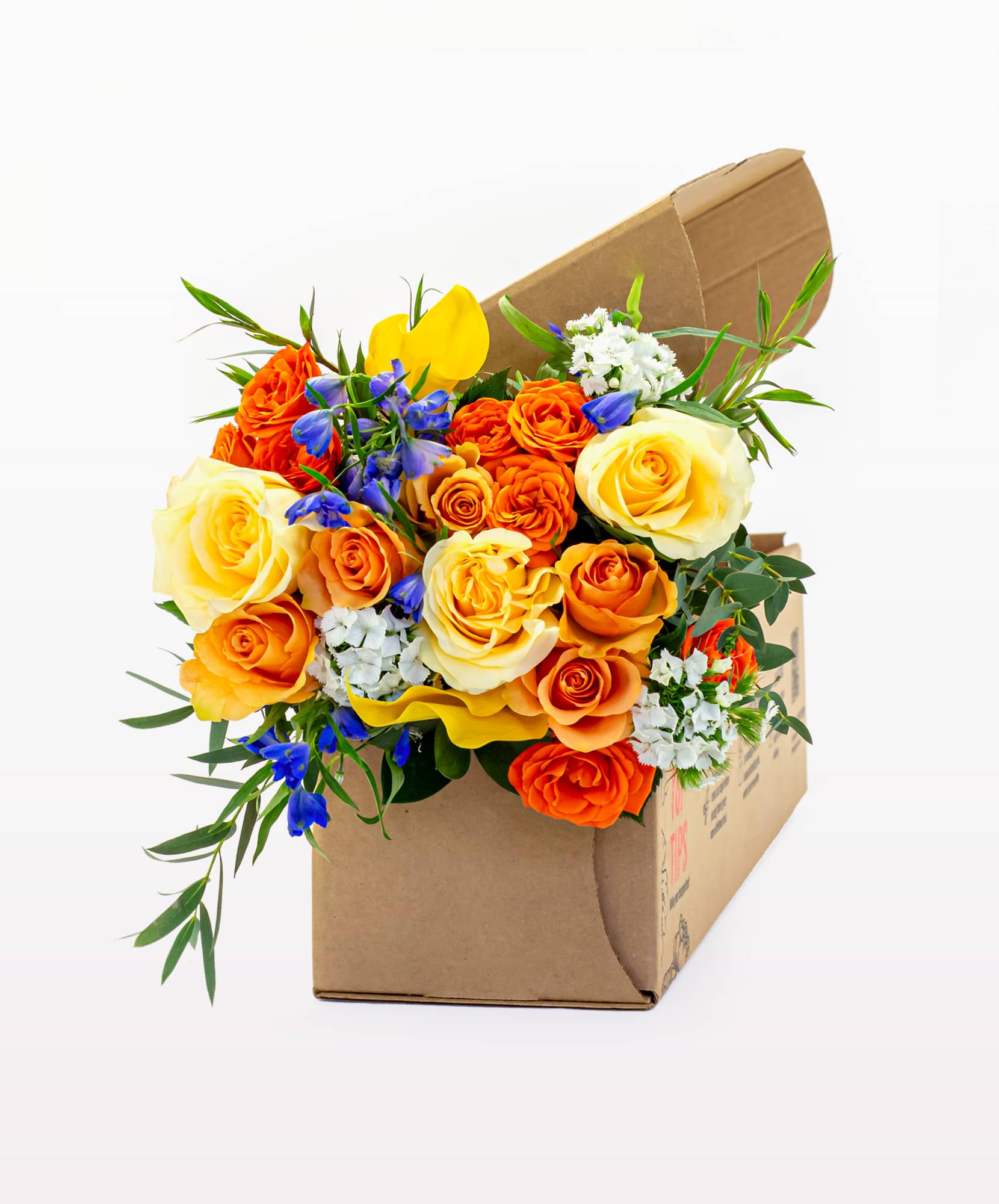 Vibrant floral arrangement featuring orange, yellow roses, and mixed blooms in a gift box.