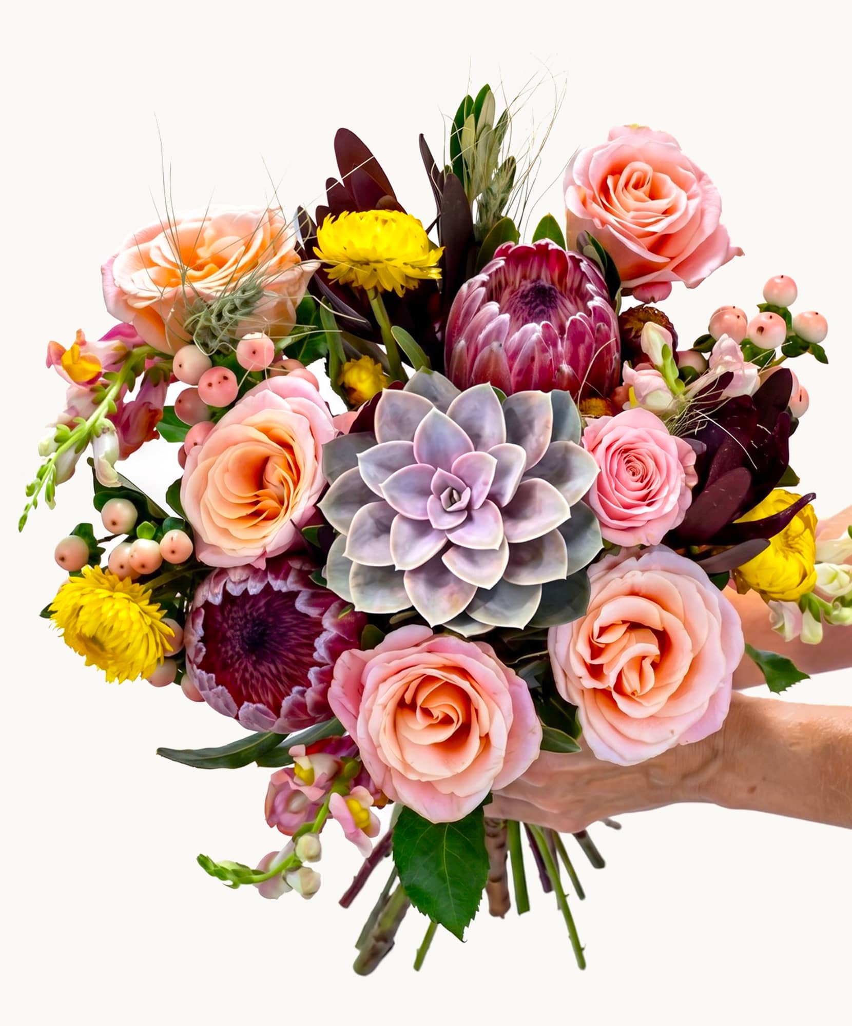 Vibrant floral bouquet featuring pink roses, succulents, and assorted blooms. Perfect gift!