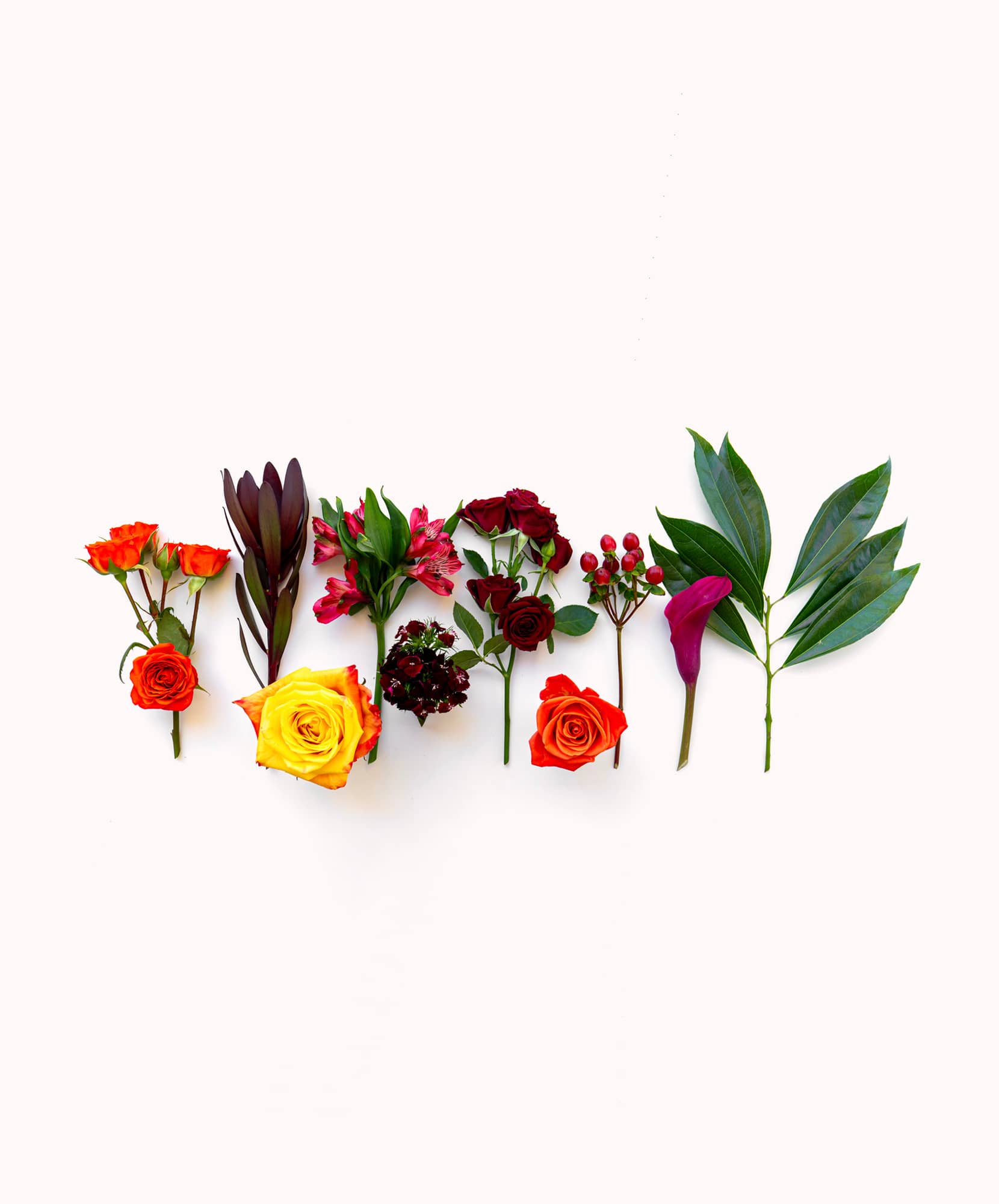 Colorful floral arrangement featuring roses, lilies, and green foliage, ideal for gifts.